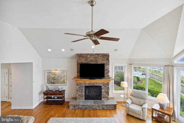 Fireplace, Interior, Living room, Recessed Lighting, Stone Walls, Wood Texture Flooring