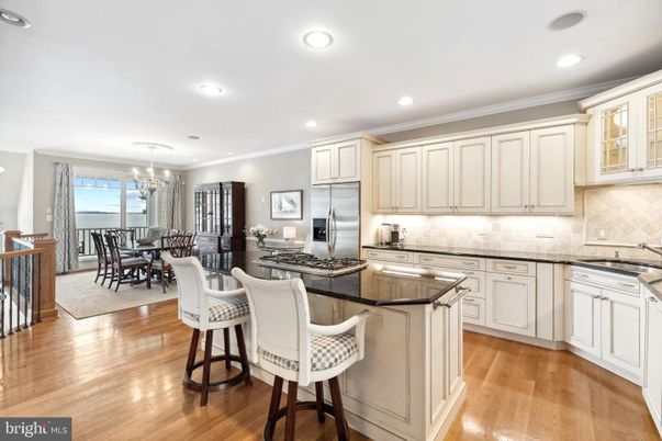 Chandelier, Dining room, Interior, Kitchen, Pendant Lights, Recessed Lighting, Stainless Steel Appliances, Wood Texture Flooring