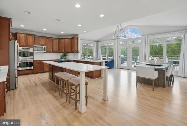 Dining room, Interior, Kitchen, Pendant Lights, Recessed Lighting, Stainless Steel Appliances, Wood Texture Flooring