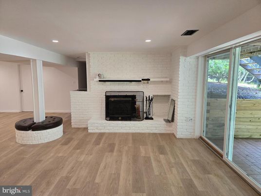 Empty room, Fireplace, Interior, Recessed Lighting, Stone Walls, Wood Texture Flooring