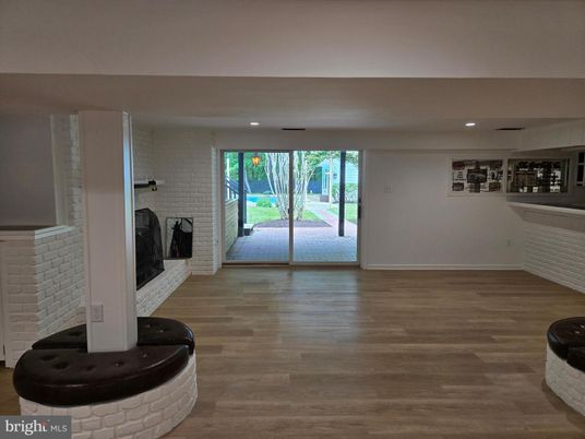 Empty room, Fireplace, Interior, Recessed Lighting, Stone Walls, Wood Texture Flooring
