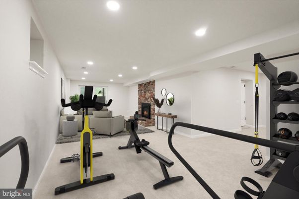 Fireplace, Fitness Equipment, Interior, Living room, Recessed Lighting, Stone Walls