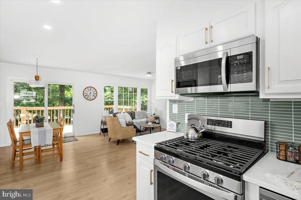 Dining room, Interior, Kitchen, Living room, Pendant Lights, Recessed Lighting, Stainless Steel Appliances, Wood Texture Flooring