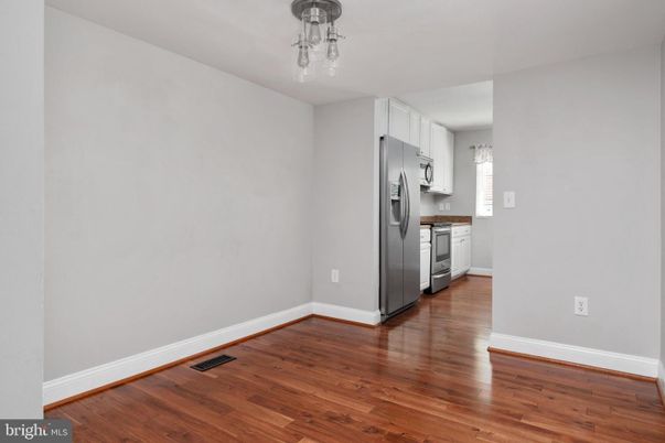 Empty room, Interior, Kitchen, Stainless Steel Appliances, Wood Texture Flooring