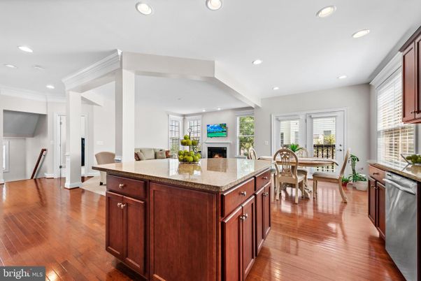 Dining room, Fireplace, Interior, Kitchen, Recessed Lighting, Wood Texture Flooring