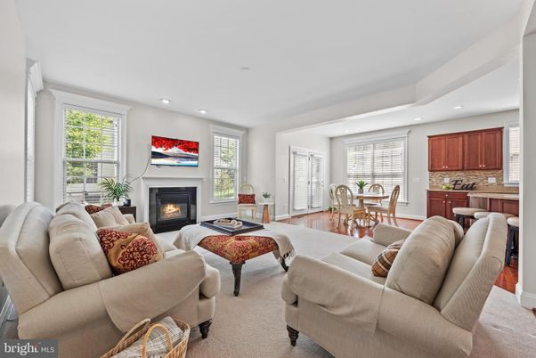 Dining room, Fireplace, Interior, Living room, Recessed Lighting, Wood Texture Flooring