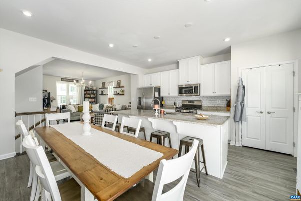 Chandelier, Dining room, Interior, Kitchen, Recessed Lighting, Stainless Steel Appliances, Wood Texture Flooring