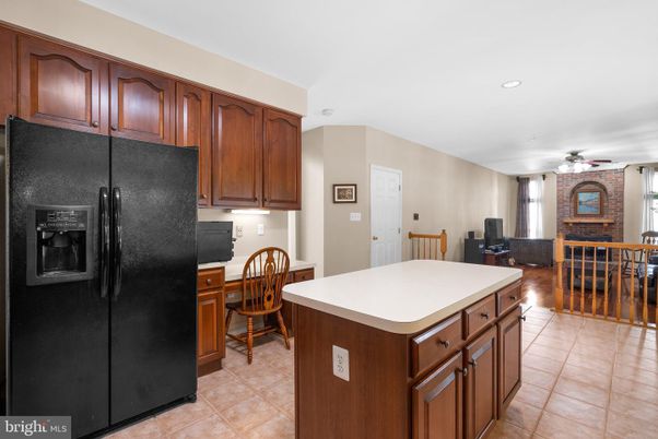 Dining room, Fireplace, Interior, Kitchen, Living room, Recessed Lighting, Stone Walls, Wood Texture Flooring