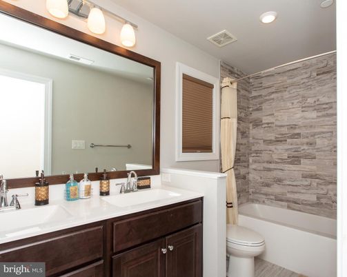 Bathroom, Dual Sink Vanities, Interior, Recessed Lighting, Wood Texture Flooring