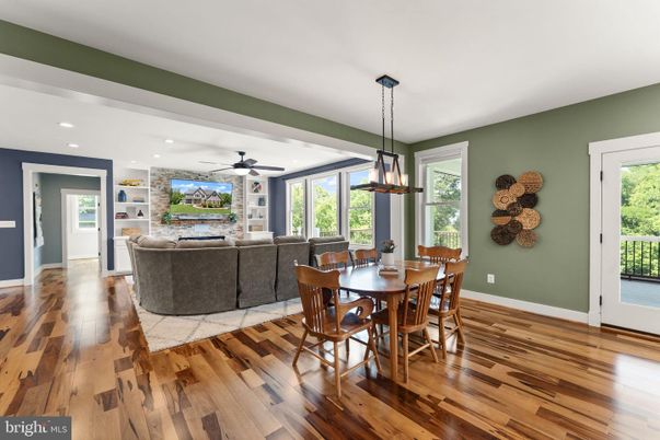 Dining room, Fireplace, Interior, Living room, Pendant Lights, Recessed Lighting, Stone Walls, Wood Texture Flooring