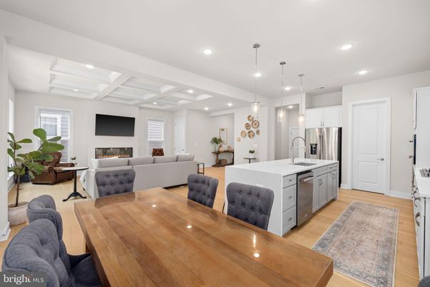 Dining room, Fireplace, Interior, Kitchen, Living room, Pendant Lights, Recessed Lighting, Stainless Steel Appliances, Wood Texture Flooring
