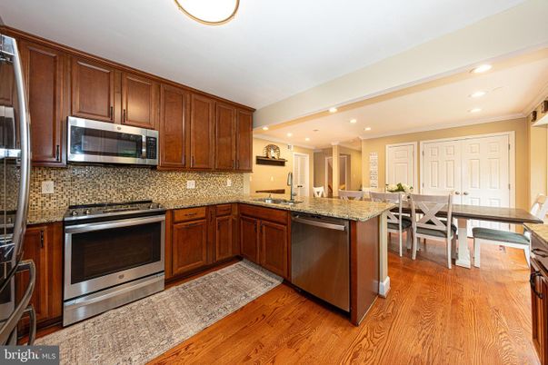 Dining room, Interior, Kitchen, Recessed Lighting, Stainless Steel Appliances, Wood Texture Flooring