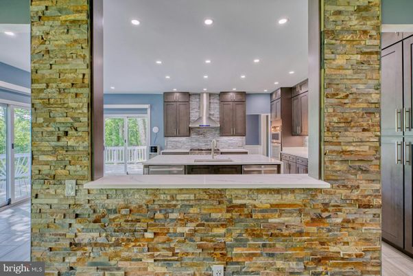 Interior, Kitchen, Recessed Lighting, Stainless Steel Appliances, Stone Walls