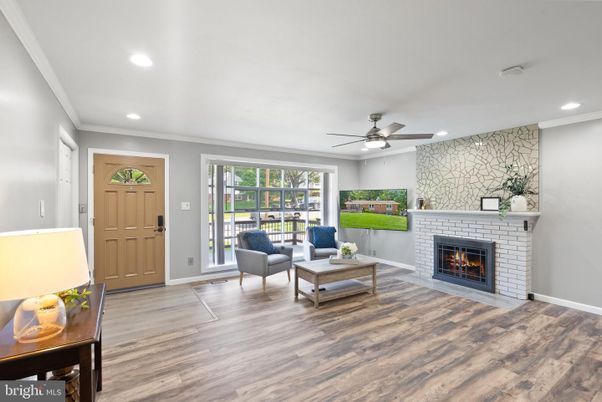 Fireplace, Interior, Living room, Recessed Lighting, Stone Walls, Wood Texture Flooring