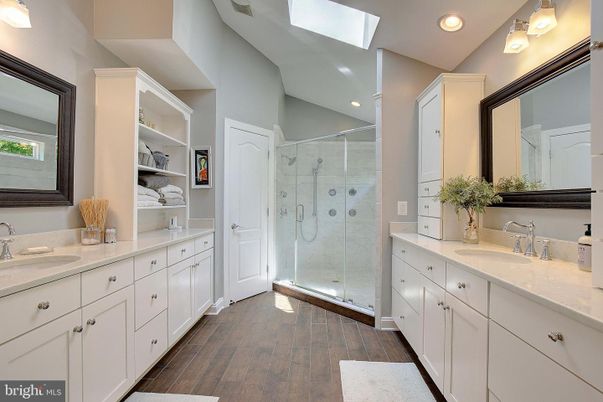 Bathroom, Dual Sink Vanities, Glass Shower, Interior, Recessed Lighting, Wood Texture Flooring