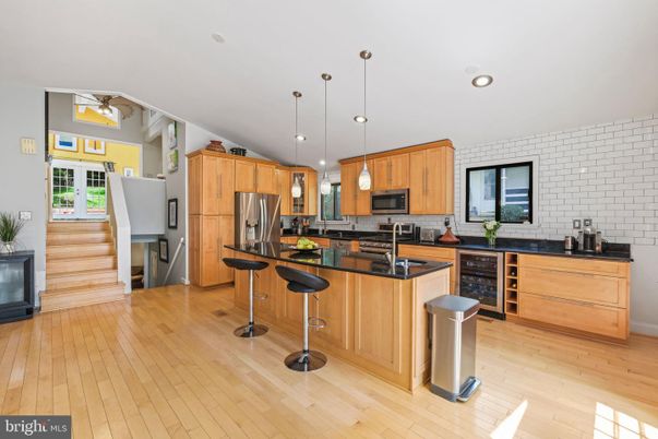 Interior, Kitchen, Pendant Lights, Recessed Lighting, Stainless Steel Appliances, Stone Walls, Wood Texture Flooring