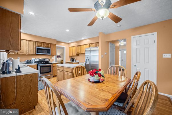 Dining room, Interior, Kitchen, Recessed Lighting, Stainless Steel Appliances, Wood Texture Flooring