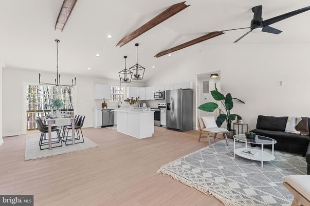 Dining room, Interior, Kitchen, Living room, Pendant Lights, Recessed Lighting, Stainless Steel Appliances, Wooden Beams, Wood Texture Flooring