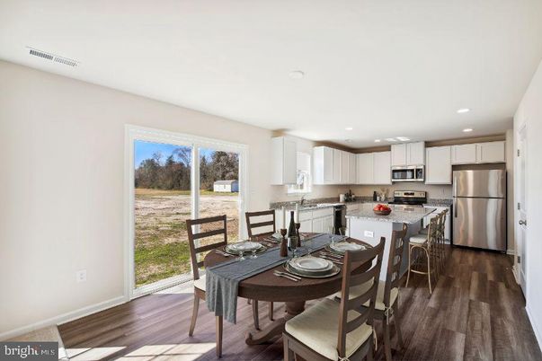 Dining room, Interior, Kitchen, Recessed Lighting, Stainless Steel Appliances, Wood Texture Flooring