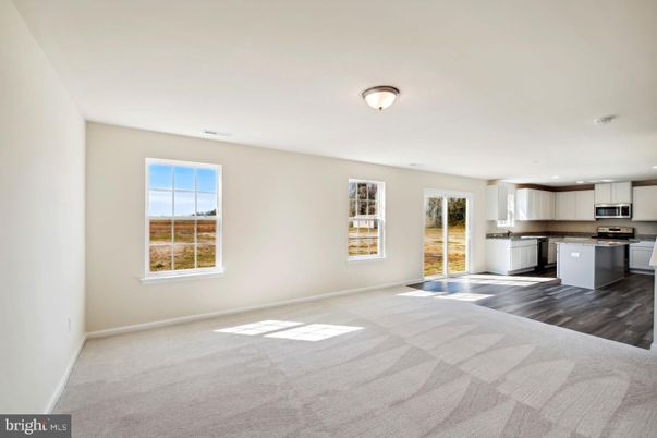 Empty room, Interior, Kitchen, Recessed Lighting, Stainless Steel Appliances, Wood Texture Flooring