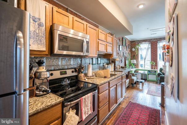 Interior, Kitchen, Recessed Lighting, Stainless Steel Appliances, Stone Walls, Wood Texture Flooring