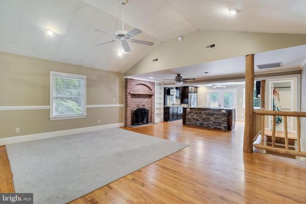 Empty room, Fireplace, Interior, Recessed Lighting, Stone Walls, Wood Texture Flooring