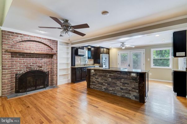 Fireplace, Interior, Kitchen, Recessed Lighting, Stone Walls, Wood Texture Flooring
