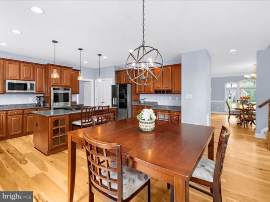 Chandelier, Dining room, Interior, Kitchen, Pendant Lights, Recessed Lighting, Stainless Steel Appliances, Wood Texture Flooring