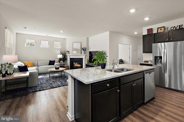 Fireplace, Interior, Kitchen, Living room, Recessed Lighting, Stainless Steel Appliances, Wood Texture Flooring
