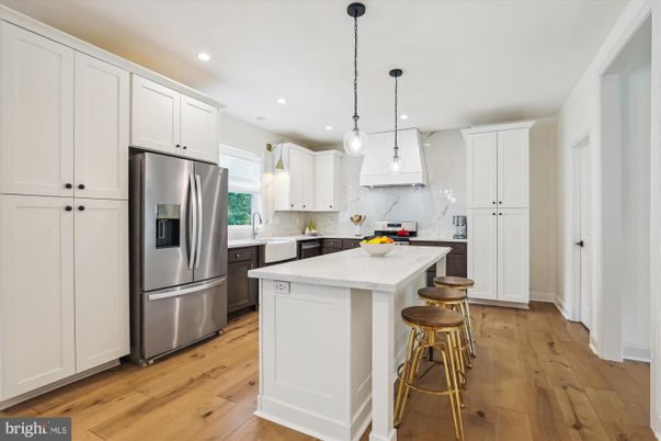 Interior, Kitchen, Marble Walls, Pendant Lights, Recessed Lighting, Stainless Steel Appliances, Wood Texture Flooring