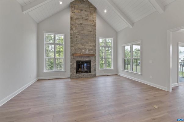 Empty room, Fireplace, Interior, Recessed Lighting, Stone Walls, Wood Texture Flooring