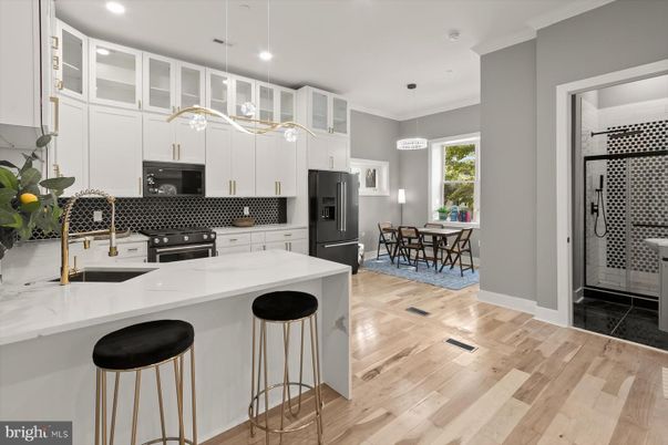Dining room, Interior, Kitchen, Pendant Lights, Recessed Lighting, Stainless Steel Appliances, Wood Texture Flooring