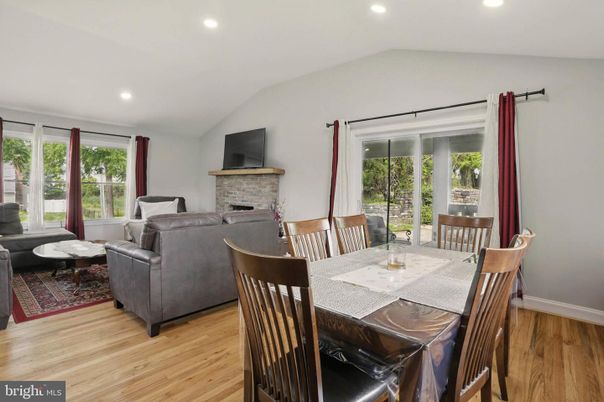 Dining room, Fireplace, Interior, Living room, Recessed Lighting, Wood Texture Flooring