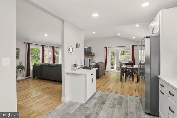 Dining room, Fireplace, Interior, Kitchen, Living room, Recessed Lighting, Wood Texture Flooring