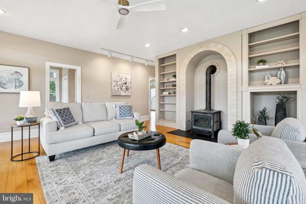 Fireplace, Interior, Living room, Recessed Lighting, Stone Walls, Wood Texture Flooring