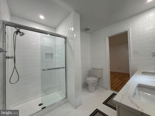 Bathroom, Dual Sink Vanities, Glass Shower, Interior, Recessed Lighting, Wood Texture Flooring