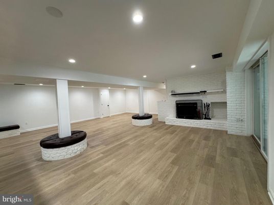 Empty room, Fireplace, Interior, Recessed Lighting, Stone Walls, Wood Texture Flooring