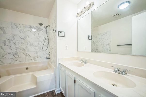 Bathroom, Dual Sink Vanities, Interior, Marble Walls, Wood Texture Flooring