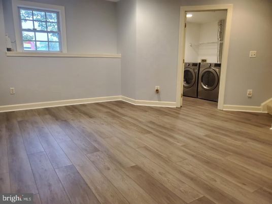 Empty room, Interior, Recessed Lighting, Utility Closets, Washer, Wood Texture Flooring