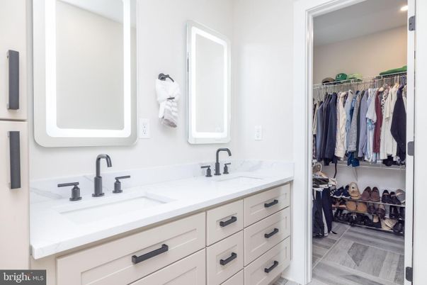 Bathroom, Dual Sink Vanities, Interior, Recessed Lighting, Walk-in Closets, Wood Texture Flooring