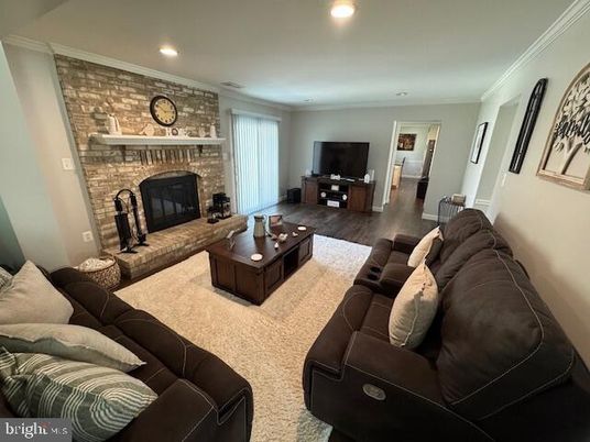 Fireplace, Interior, Living room, Recessed Lighting, Stone Walls, Wood Texture Flooring