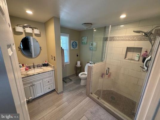 Bathroom, Dual Sink Vanities, Glass Shower, Interior, Recessed Lighting, Wood Texture Flooring