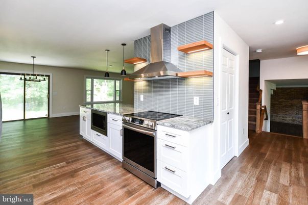 Interior, Kitchen, Pendant Lights, Recessed Lighting, Stainless Steel Appliances, Stone Walls, Wood Texture Flooring