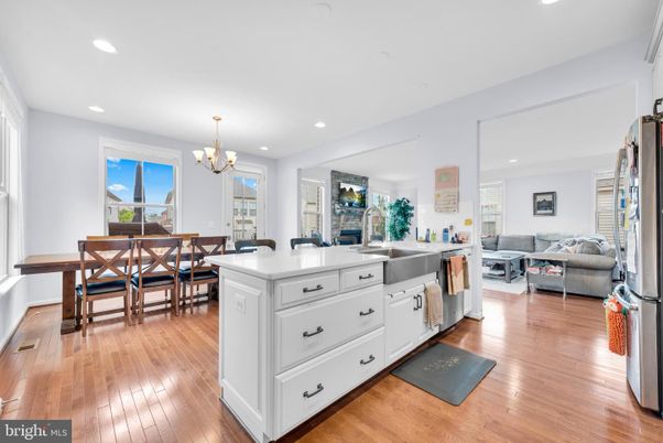 Chandelier, Dining room, Fireplace, Interior, Kitchen, Living room, Recessed Lighting, Wood Texture Flooring