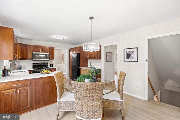 Chandelier, Dining room, Interior, Kitchen, Pendant Lights, Stainless Steel Appliances, Wood Texture Flooring