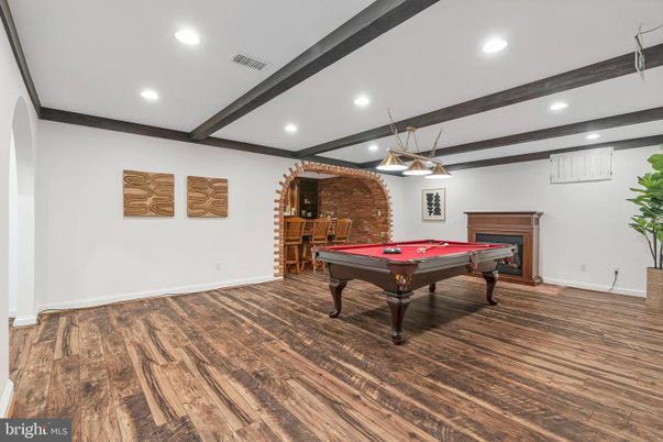 Billiard Table, Fireplace, Game Room, Interior, Pendant Lights, Recessed Lighting, Stone Walls, Wood Texture Flooring