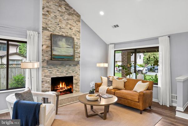 Fireplace, Interior, Living room, Recessed Lighting, Stone Walls, Wood Texture Flooring