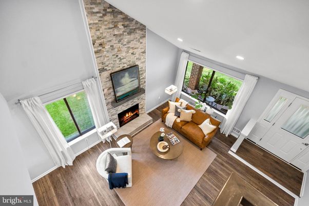 Fireplace, Interior, Living room, Recessed Lighting, Stone Walls, Wood Texture Flooring