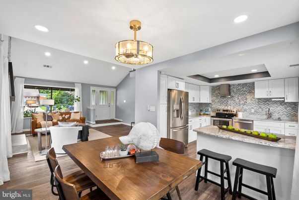 Chandelier, Dining room, Interior, Kitchen, Living room, Recessed Lighting, Stainless Steel Appliances, Wood Texture Flooring