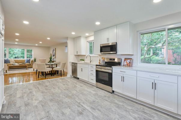 Dining room, Interior, Kitchen, Living room, Recessed Lighting, Stainless Steel Appliances, Wood Texture Flooring